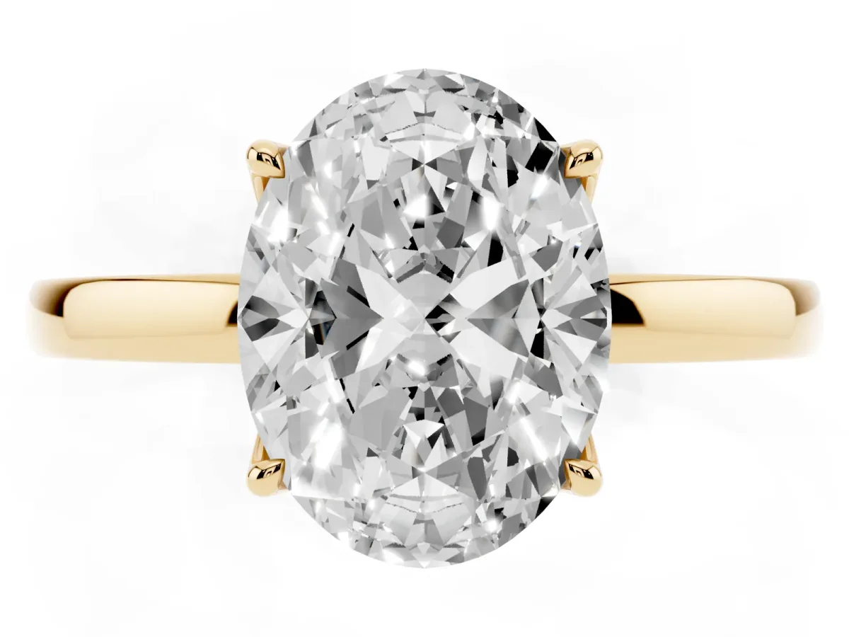 Oval Cut Diamond Solitaire Ring with Thin Band and Prong Setting Yellow gold