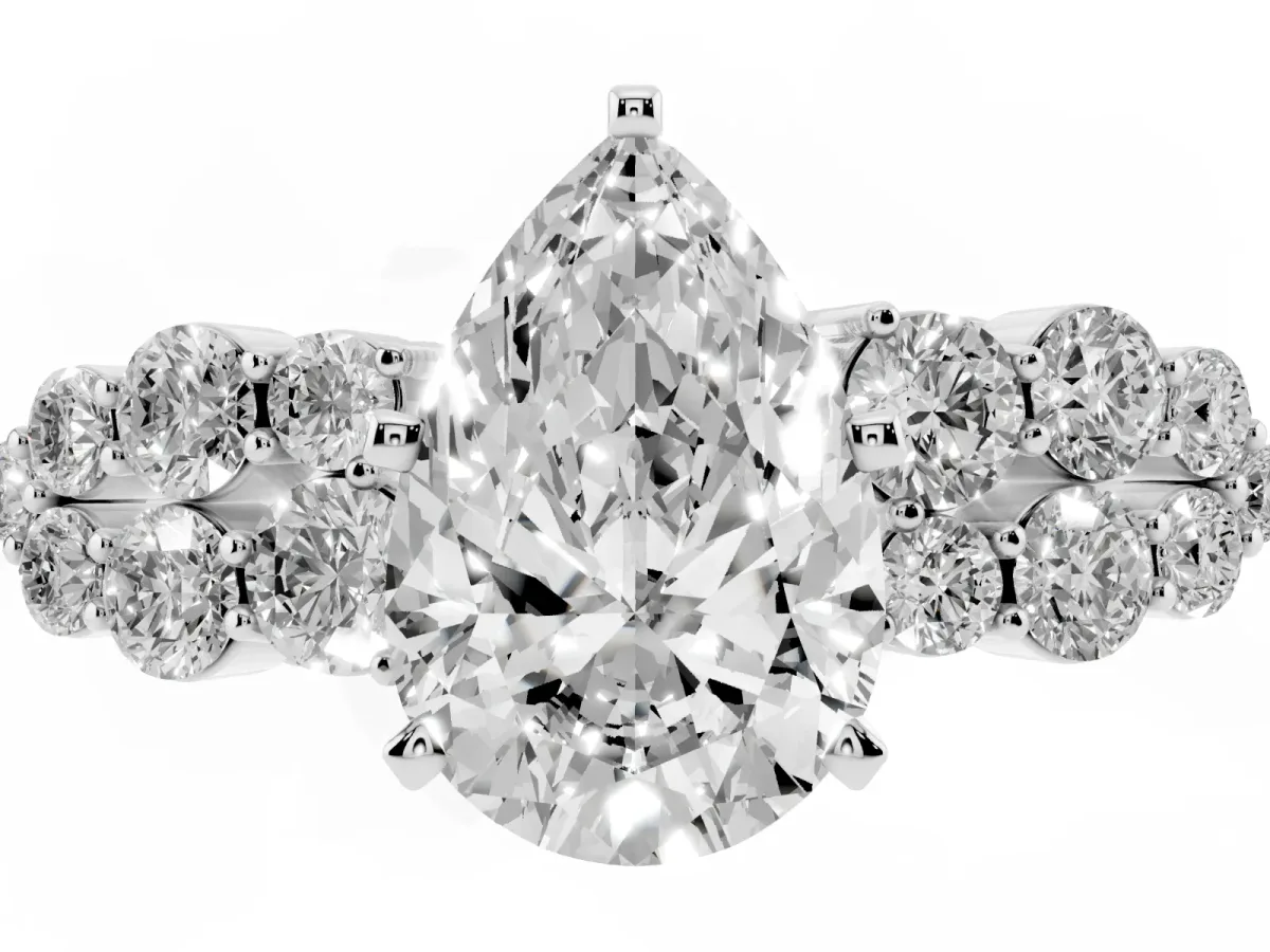 Pear Cut Cluster Diamond Engagement Ring with Pavé Band and Four-Prong Setting Silver