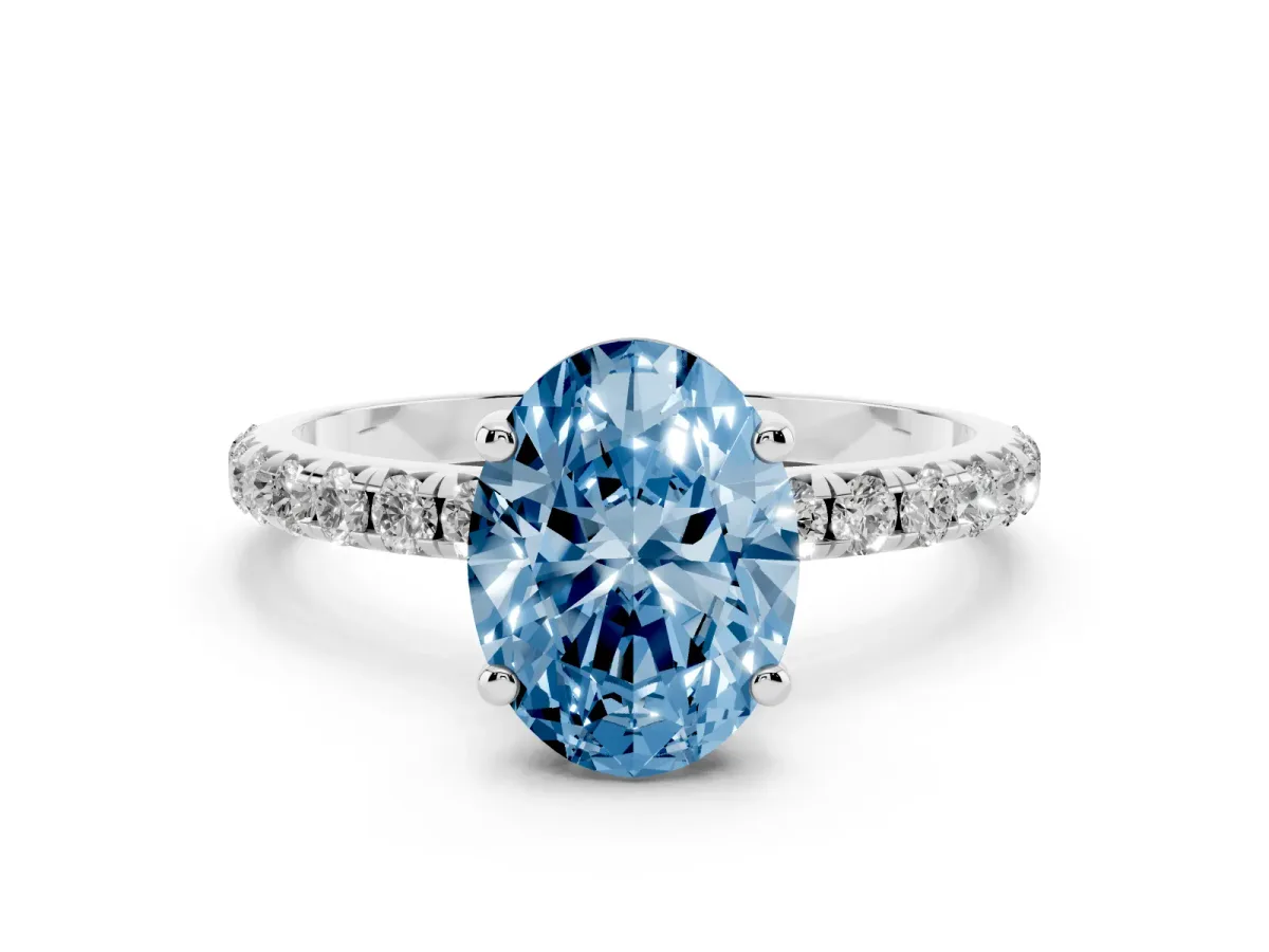 Fancy Blue Oval Cut Cut Diamond Solitaire Ring with Micro Pave Band and Four Prong Setting Silver