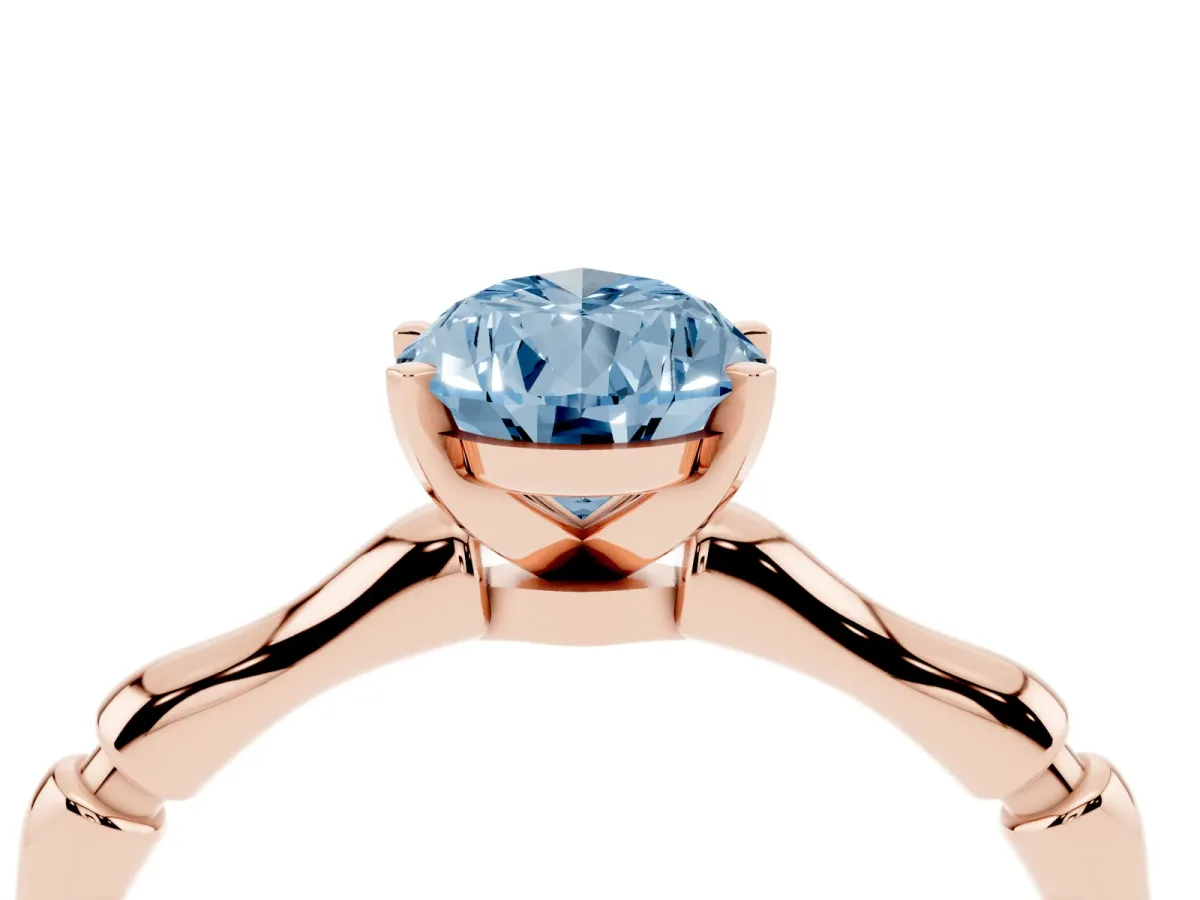 Fancy Blue Pear Cut Solitaire Diamond Ring with Bamboo Band and Four-Prong Setting Rose gold