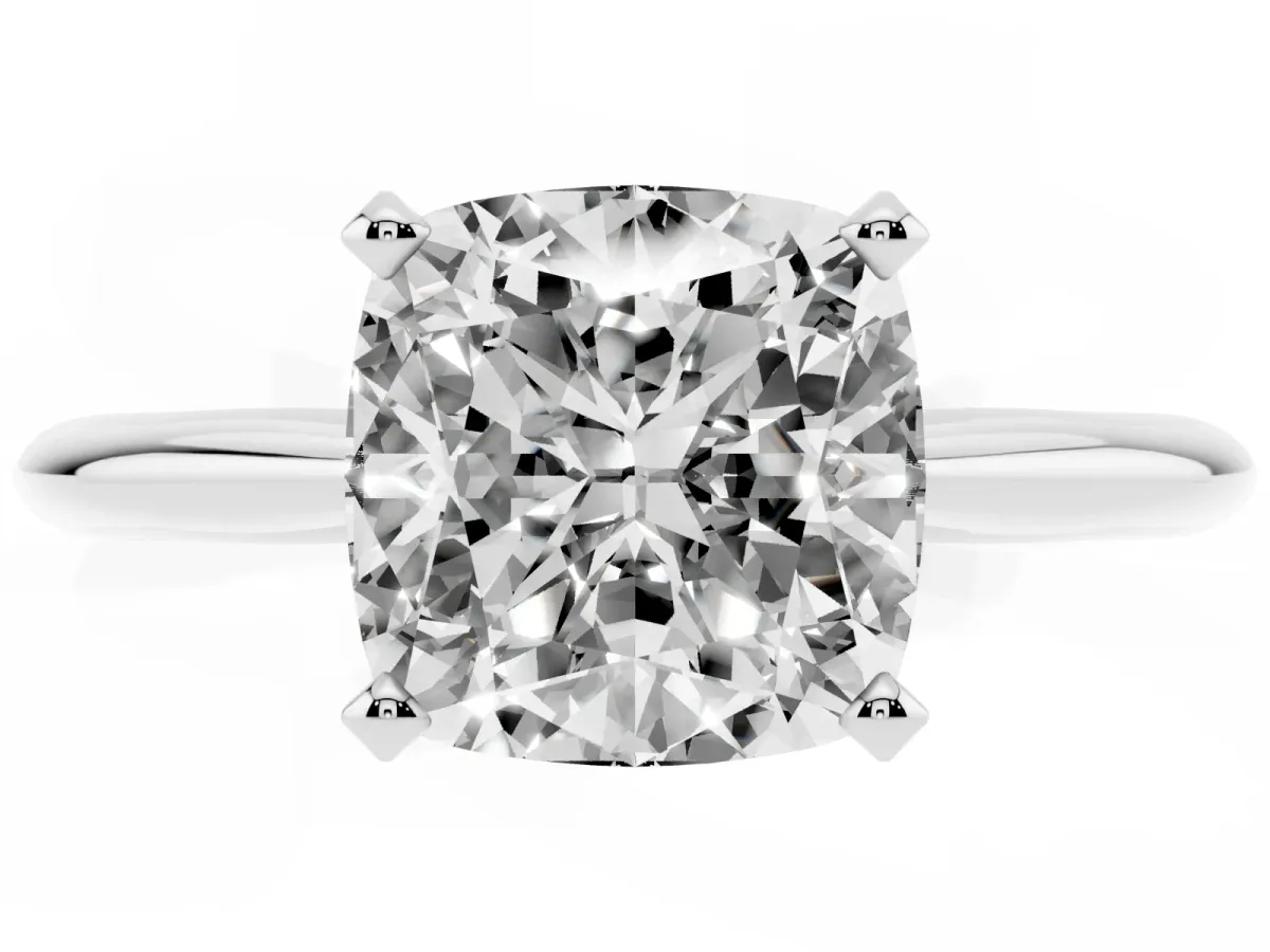 Cushion Cut Cut Solitaire Ring with Four-Prong Setting on a Classic Band Silver