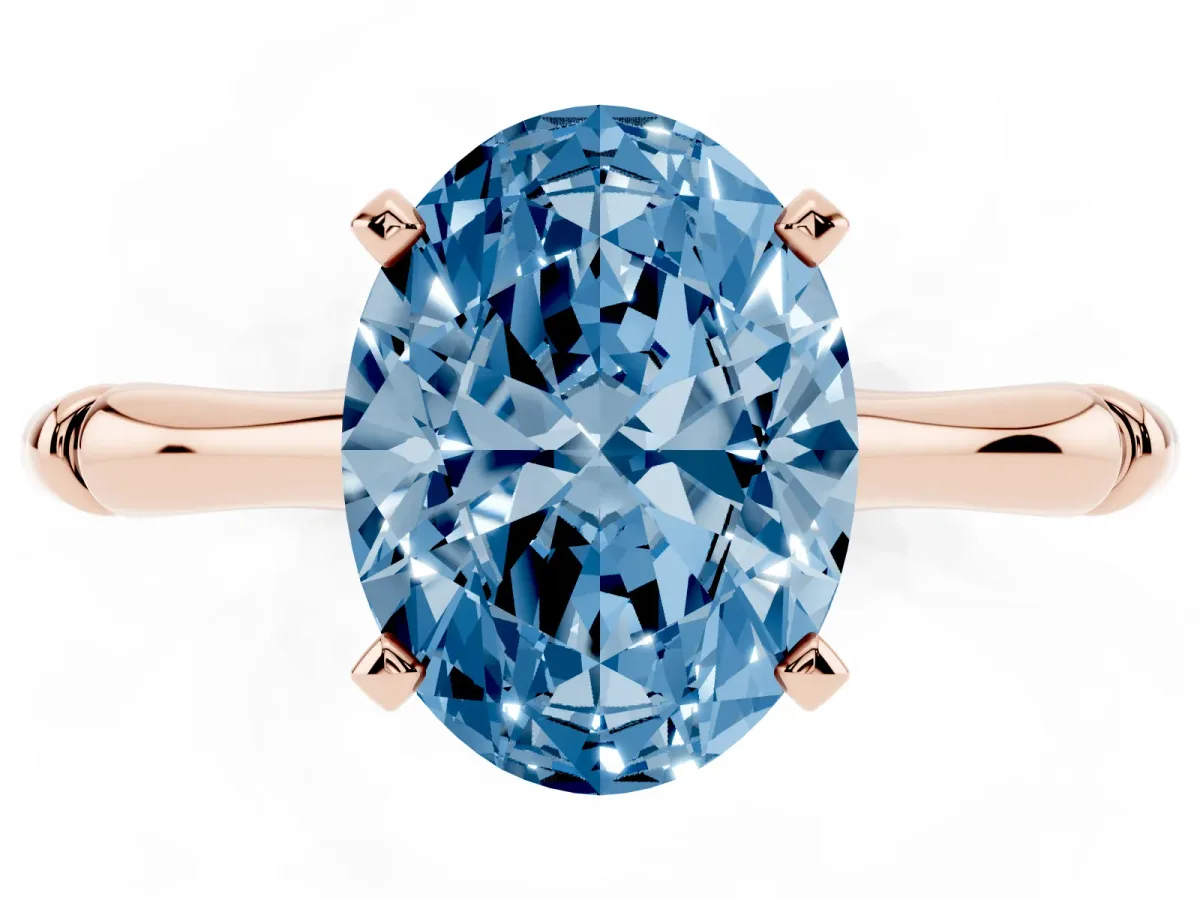 Fancy Blue Oval Cut Solitaire Diamond Ring with Bamboo Band and Four-Prong Setting Rose gold