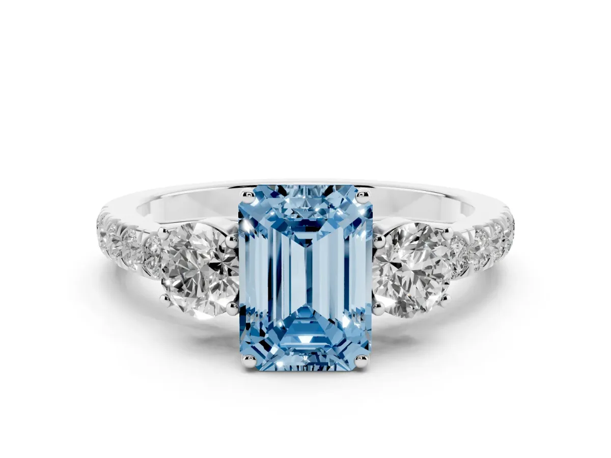 Fancy Blue Emerald Cut Cut Diamond Three-Stone Ring with Round Side Stones and Pavé Band Silver