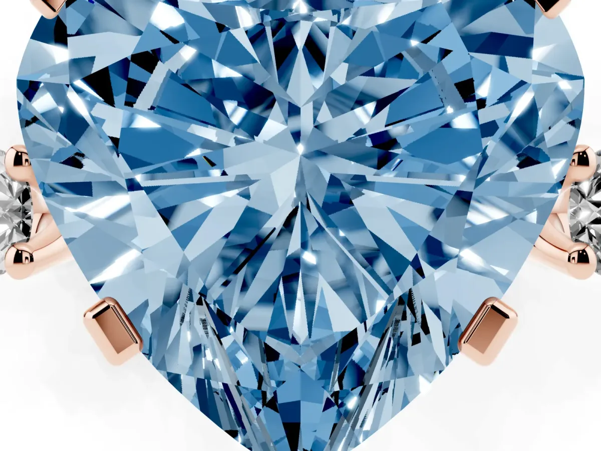 Fancy Blue Heart Cut Cut Three-Stone Solitaire Ring with Round Accent Diamonds and Four-Prong Setting Rose gold