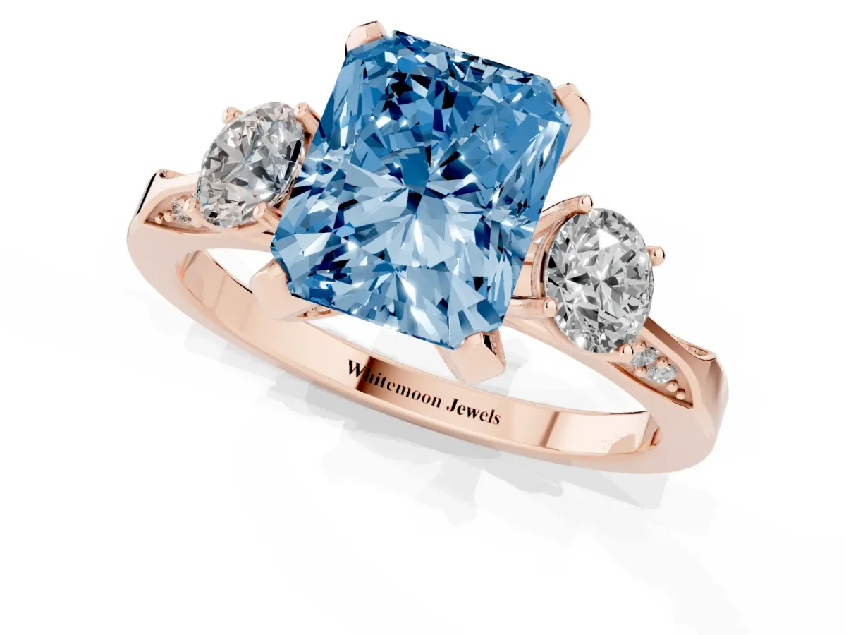 Fancy Blue Radiant Cut Brilliant Three-Stone Diamond Ring with Pavé Band and Four-Prong Setting Rose gold