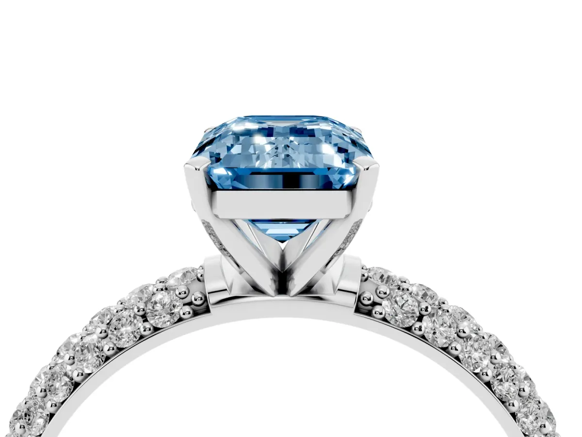 Fancy Blue Emerald Cut Diamond Solitaire Ring with Prong Setting and Pavé Band Silver