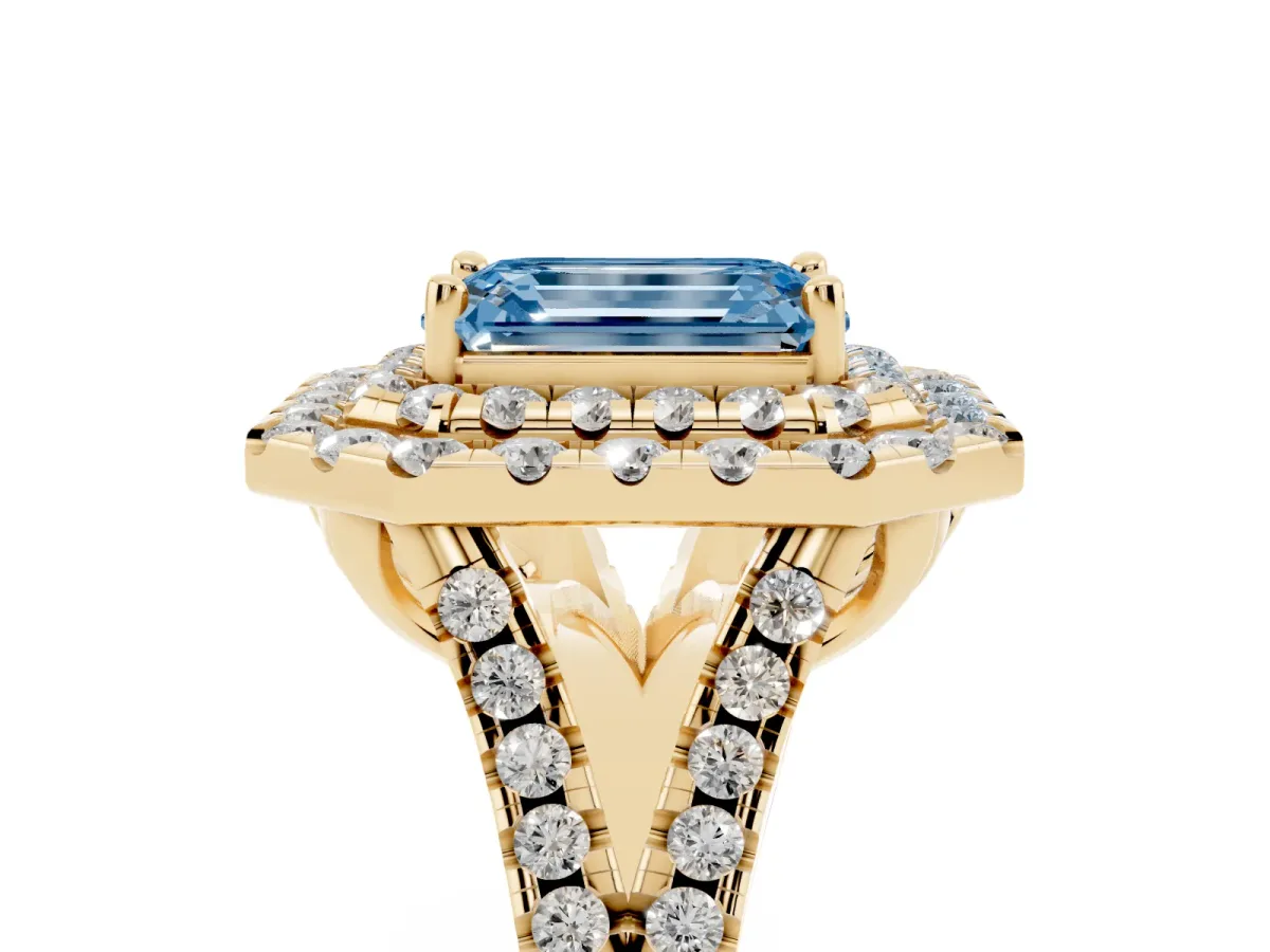 Fancy Blue Double Halo Emerald Cut Diamond Pavé Split Shank Ring with Prong Setting Yellow gold