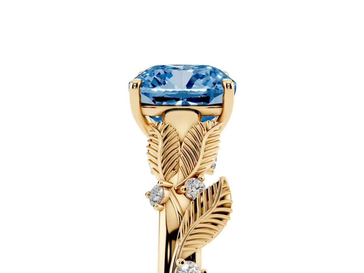 Fancy Blue Cushion Cut Diamond Solitaire Ring with Leaf Motif Band and Four-Prong Setting Yellow gold