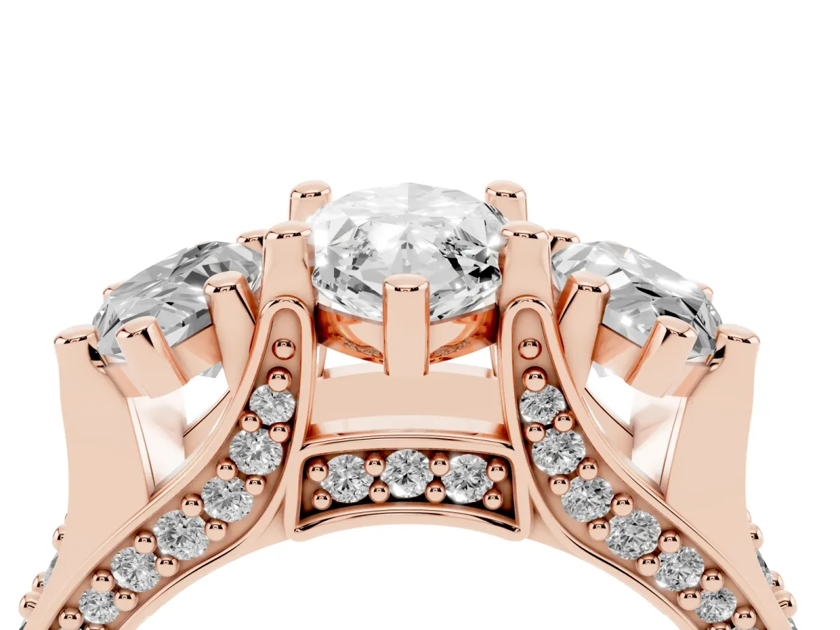 Marquise Cut Diamond Three-Stone Ring with Channel Set Band and Four-Prong Setting Rose gold