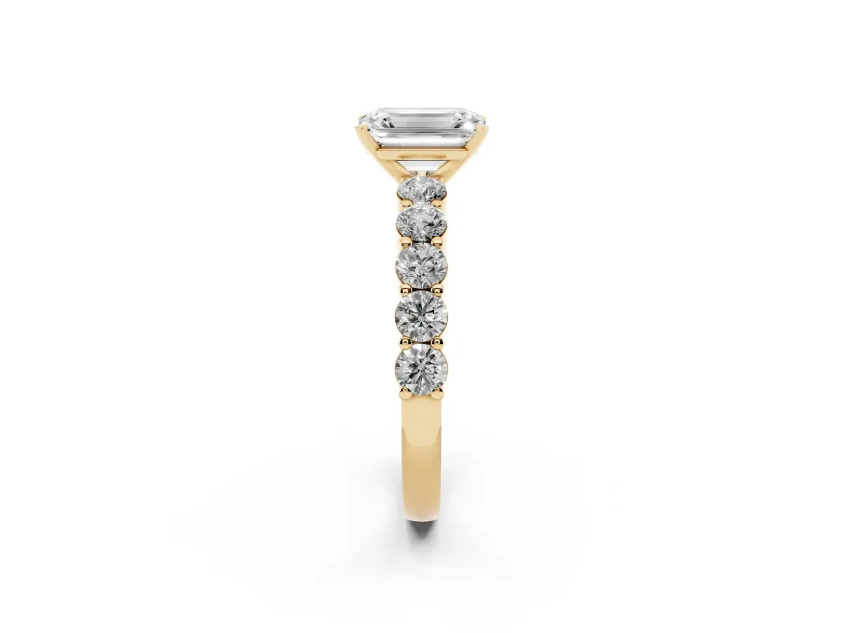 Emerald Cut Diamond Solitaire Ring with Shared Prong Round Side Stones Yellow gold