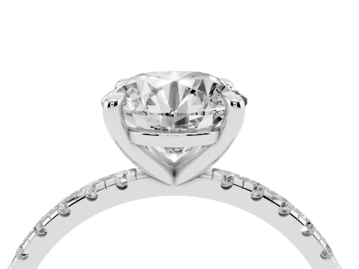 Round Cut Diamond Brilliant Solitaire Ring with Pavé Band and Four-Prong Setting Silver