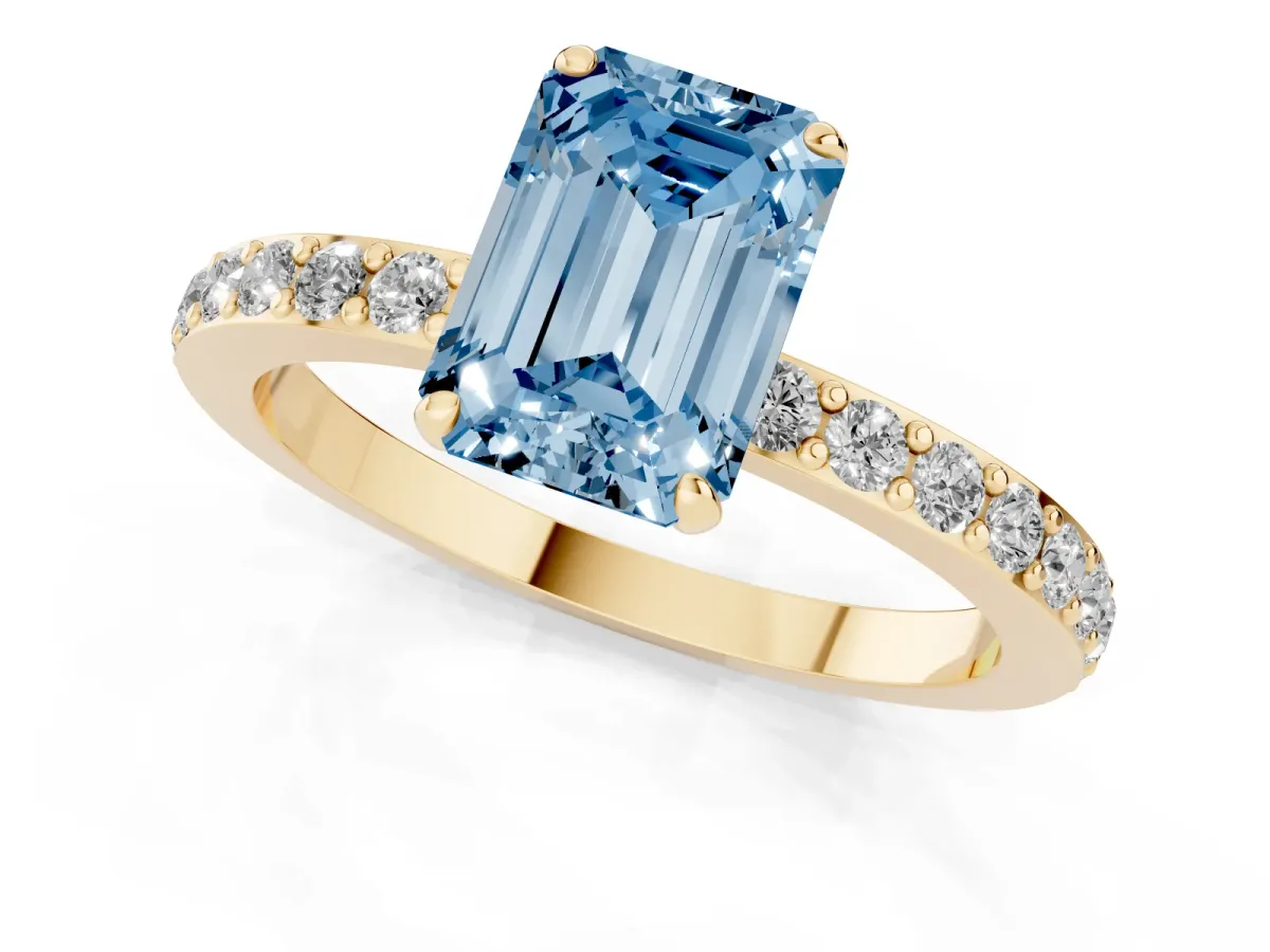Fancy Blue Emerald Cut Diamond Solitaire Engagement Ring with Pavé Band and Four-Prong Setting Yellow gold