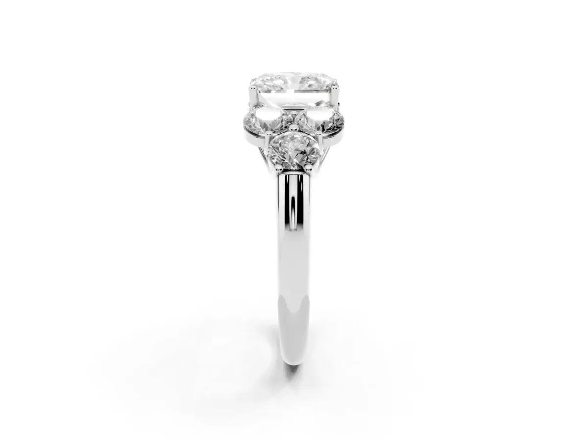 Radiant Cut Cut Diamond Cluster Ring with Round Accent Stones and Prong Setting on a Classic Band White gold