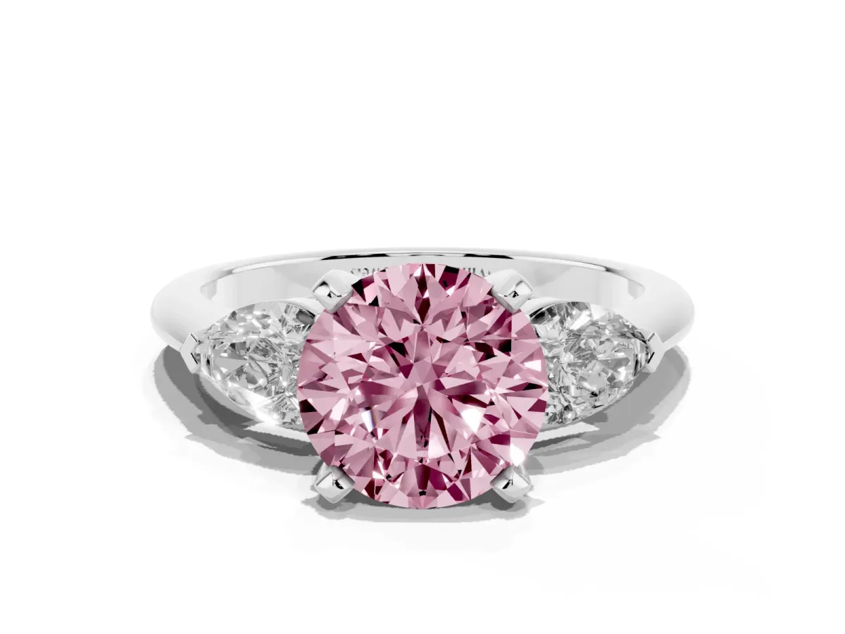 Fancy Pink Three-Stone Round Cut Diamond Ring with Pear Side Stones and Four-Prong Setting Platinum