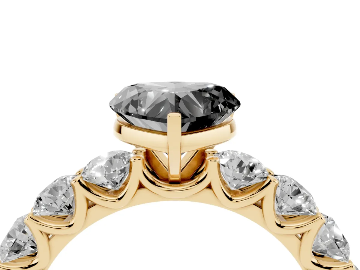 Fancy Black Heart Cut Diamond Prong Setting with Side Stones on a Pave Band Yellow gold