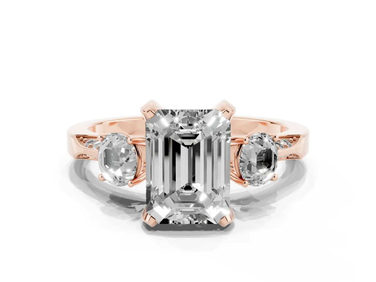 Fancy Pink Emerald Cut Brilliant Three-Stone Diamond Ring with Pavé Band and Four-Prong Setting Rose gold