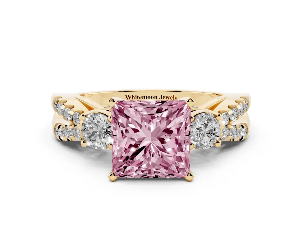 Fancy Pink Princess Cut Diamond Three-Stone Ring with Pavé Split Shank and Four-Prong Setting Yellow gold
