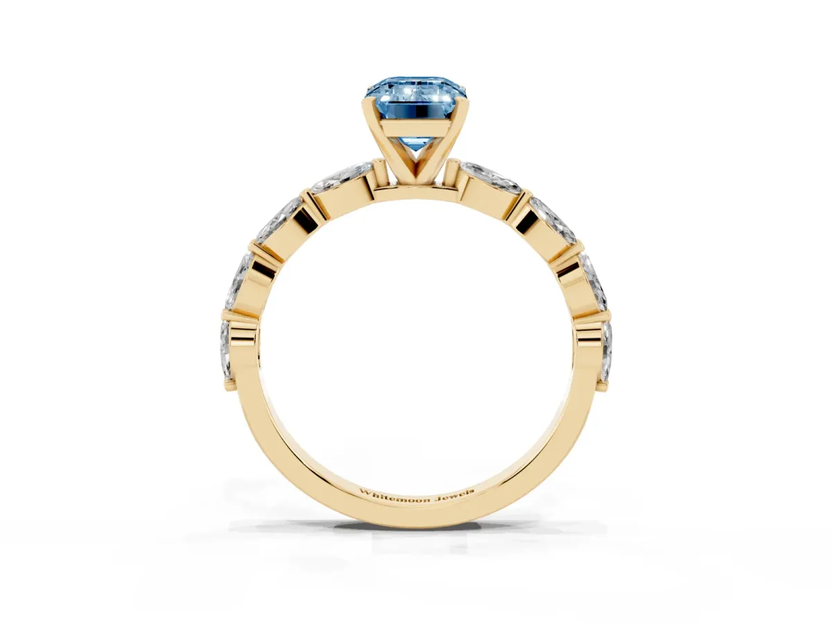 Fancy Blue Emerald Cut Diamond Ring with Marquise Side Stones and Prong Setting Yellow gold