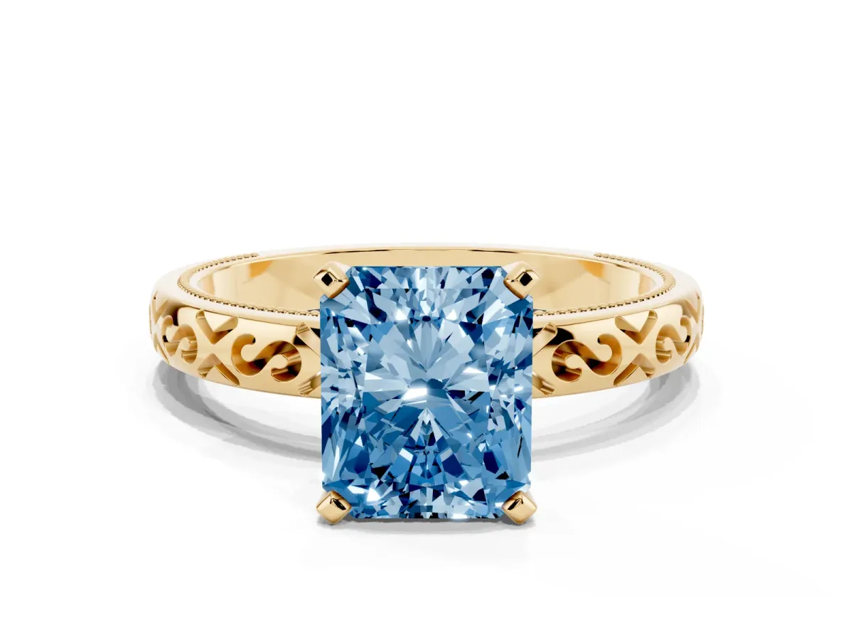 Fancy Blue Radiant Cut Solitaire Engagement Ring with Scrollwork Band and Four-Prong Setting Yellow gold