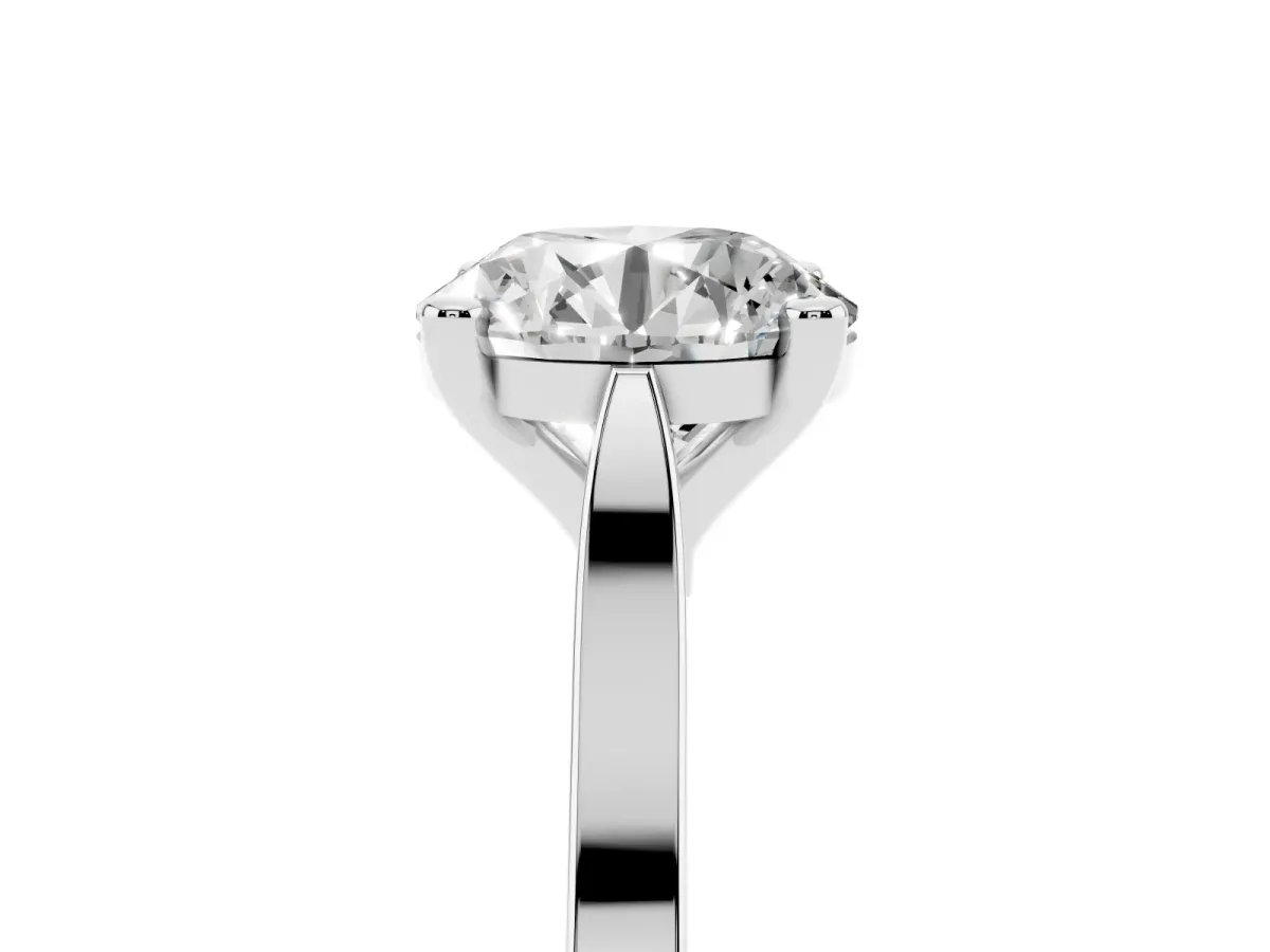 Round Cut Solitaire Diamond Ring with Four-Prong Setting and Tapered Band Platinum