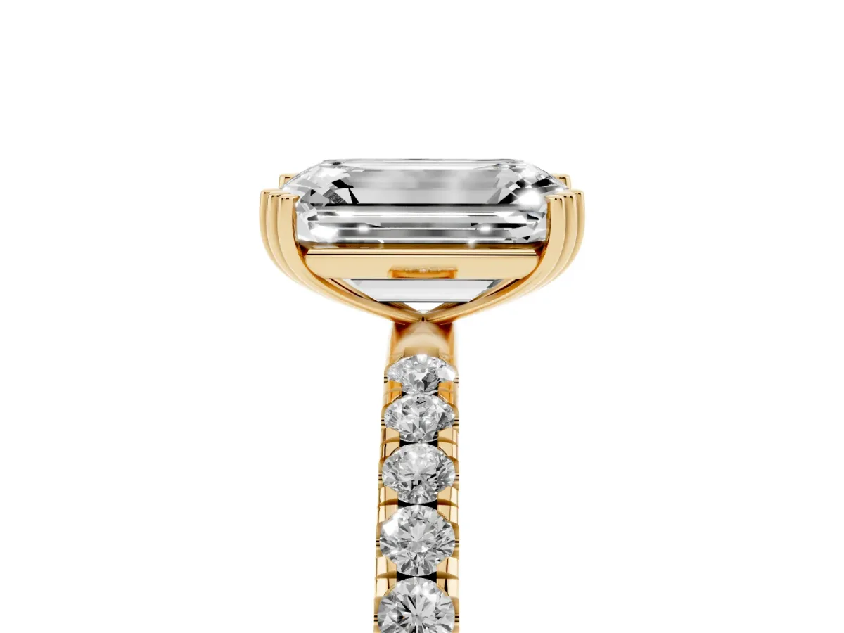 Emerald Cut Brilliant Solitaire with Pavé Band and Claw Prong Setting Yellow gold