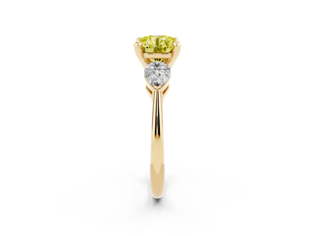 Fancy Yellow Three-Stone Round Cut Diamond Ring with Pear Side Stones and Four-Prong Setting Yellow gold