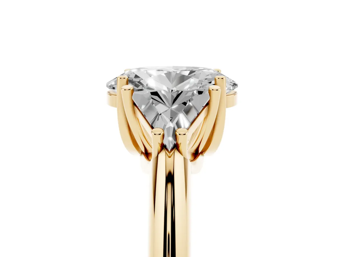 Three-Stone Oval Cut Diamond Engagement Ring with Trillion Side Stones and Prong Setting Yellow gold