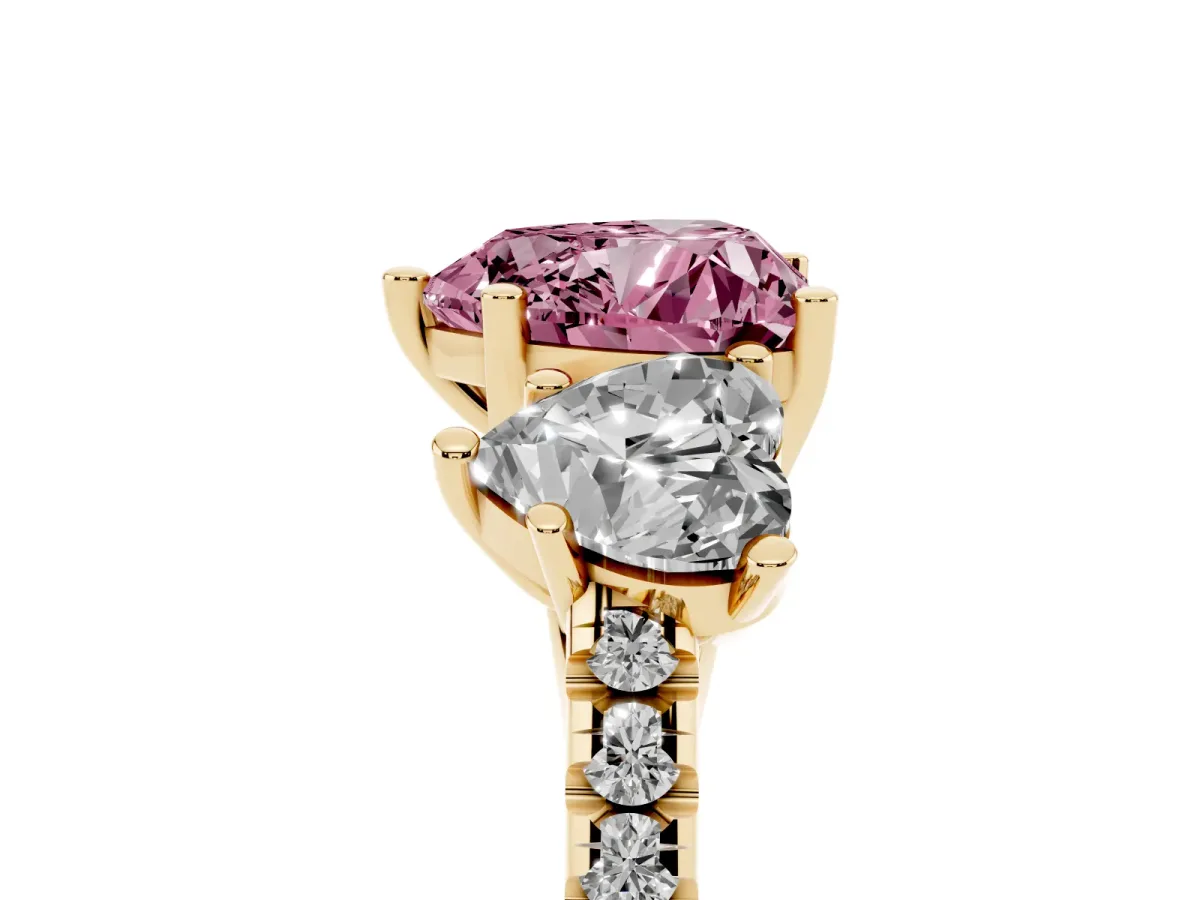 Fancy Pink Three-Stone Heart Cut Diamond Ring with Round Pavé Band and Prong Setting Yellow gold