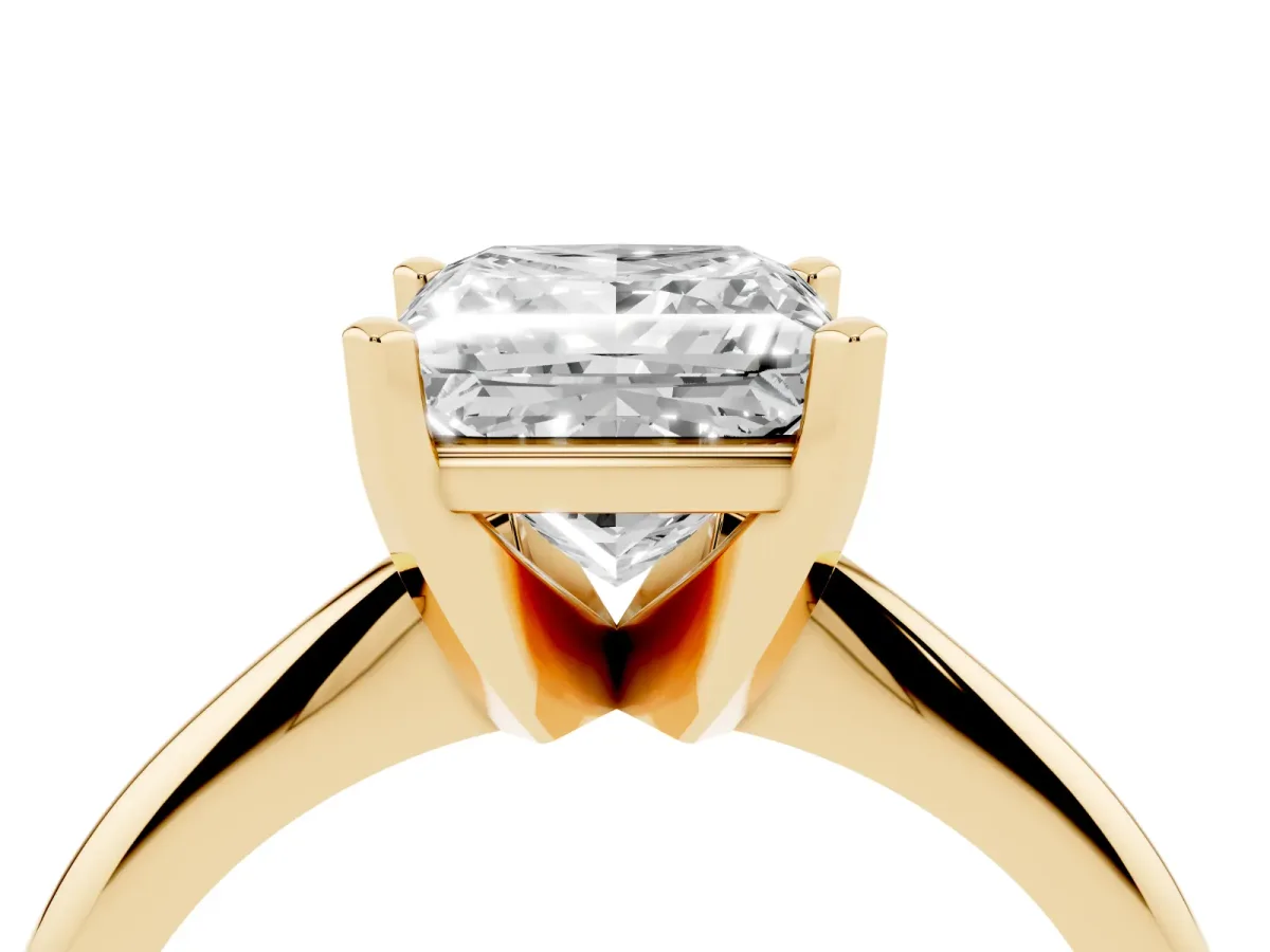 Princess Cut Cut Solitaire Ring with Four-Prong Setting on a Classic Band Yellow gold