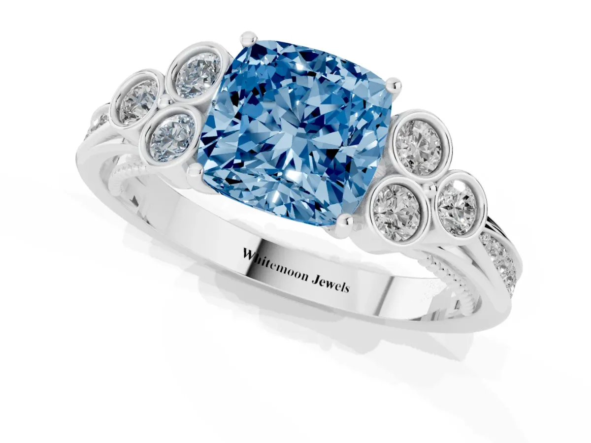 Fancy Blue Cushion Cut Cut Diamond Engagement Ring with Bezel Set Round Side Stones and Prong Setting White gold