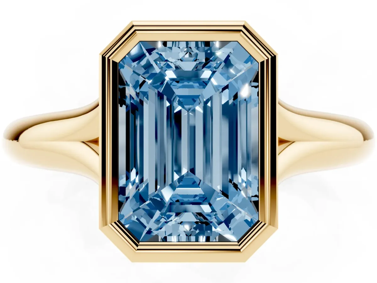 Fancy Blue Bezel Set Emerald Cut Solitaire Diamond Ring with Smooth Band Yellow gold