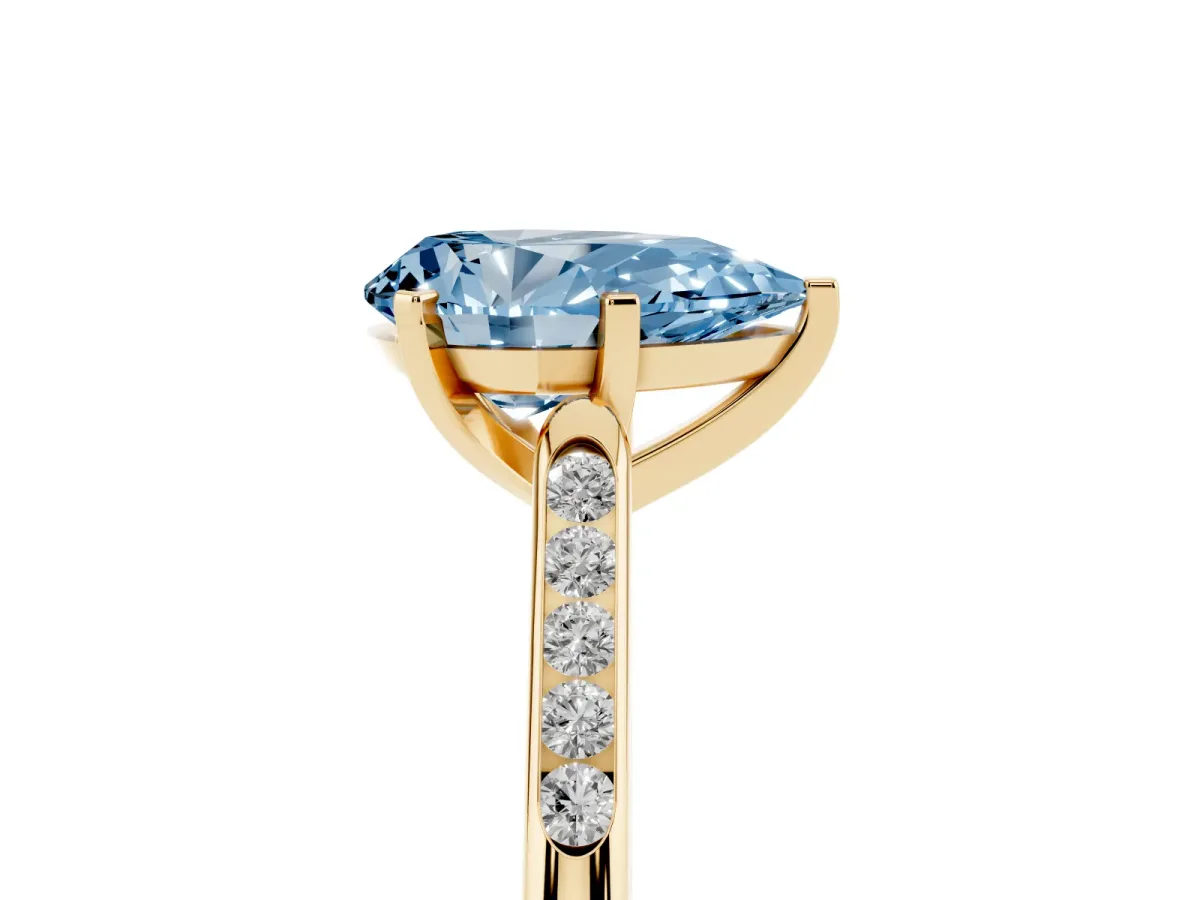 Fancy Blue Pear Cut Diamond Solitaire Ring with Channel Set Round Band and Prong Setting Yellow gold