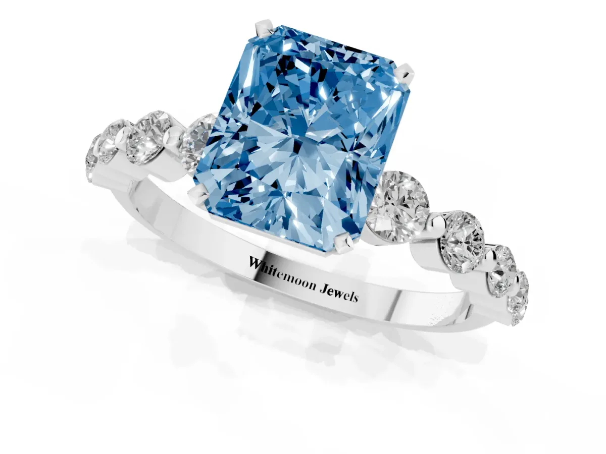 Fancy Blue Radiant Cut Solitaire Diamond Ring with Pave Band and Four-Prong Setting Silver