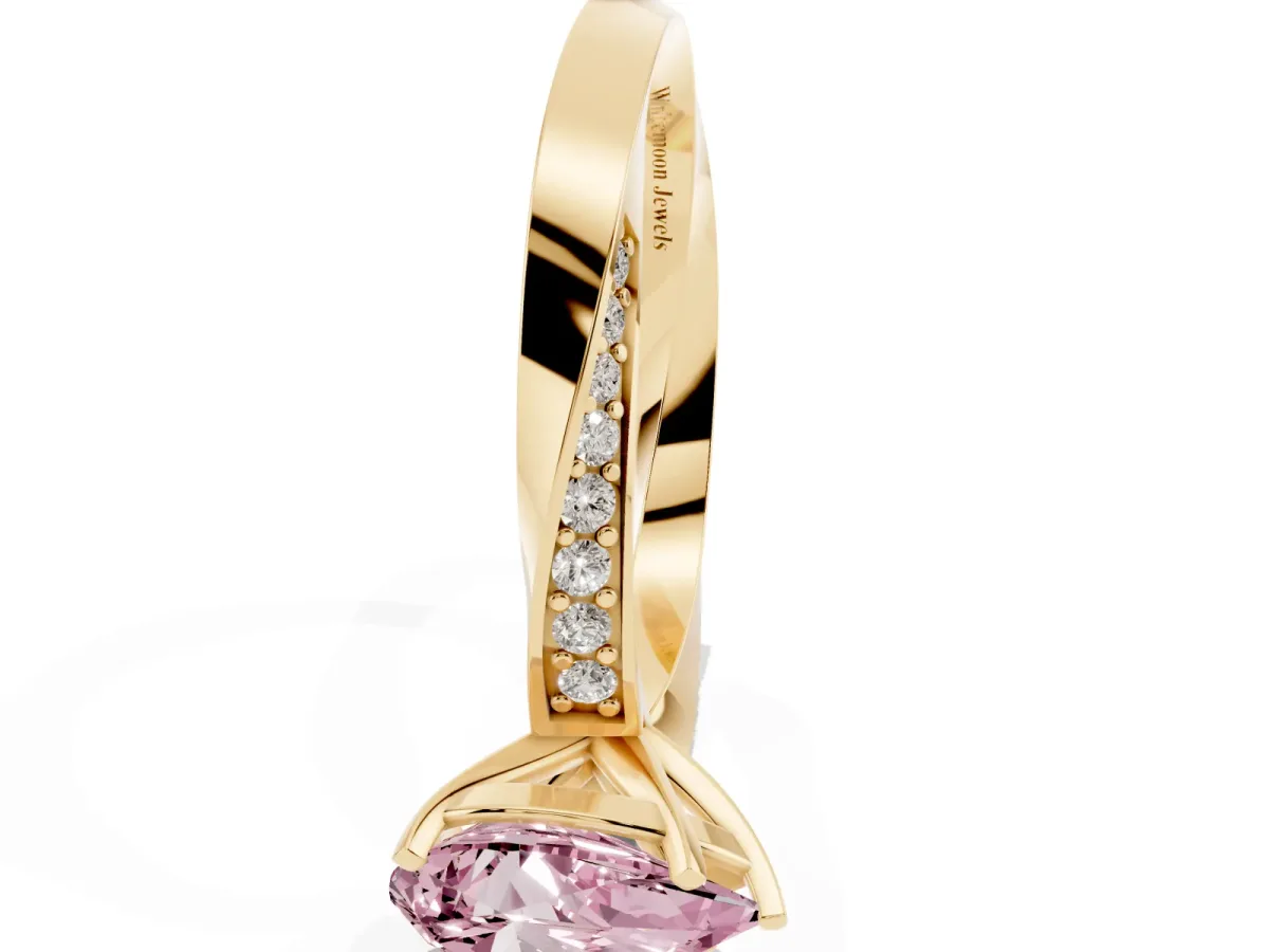 Fancy Pink Pear Cut Diamond Engagement Ring with Side Stone Accents and Four-Prong Setting Yellow gold