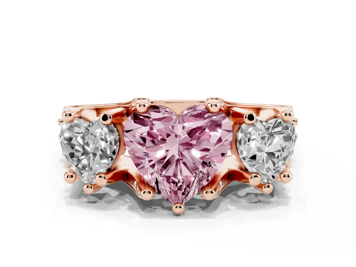 Fancy Pink Heart Cut Diamond Three-Stone Ring with Channel Set Band and Four-Prong Setting Rose gold