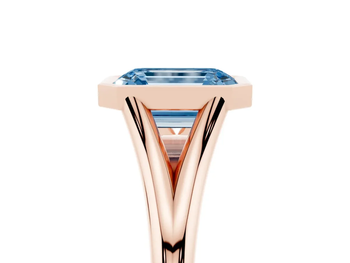 Fancy Blue Bezel Set Emerald Cut Cut Solitaire Ring with Tapered Band Rose gold
