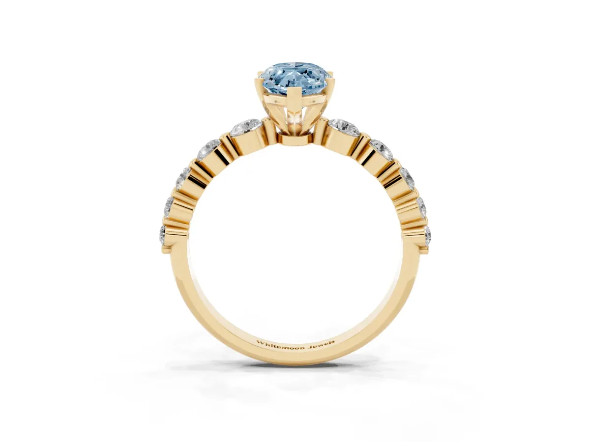Fancy Blue Marquise Cut Solitaire Diamond Ring with Pave Band and Four-Prong Setting Yellow gold