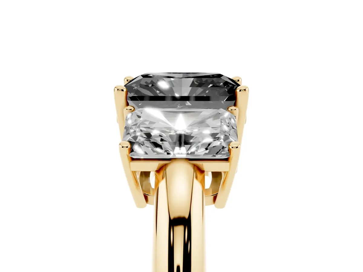 Fancy Black Three-Stone Radiant Cut Cut Diamond Engagement Ring with Prong Setting on a White Gold Band Yellow gold