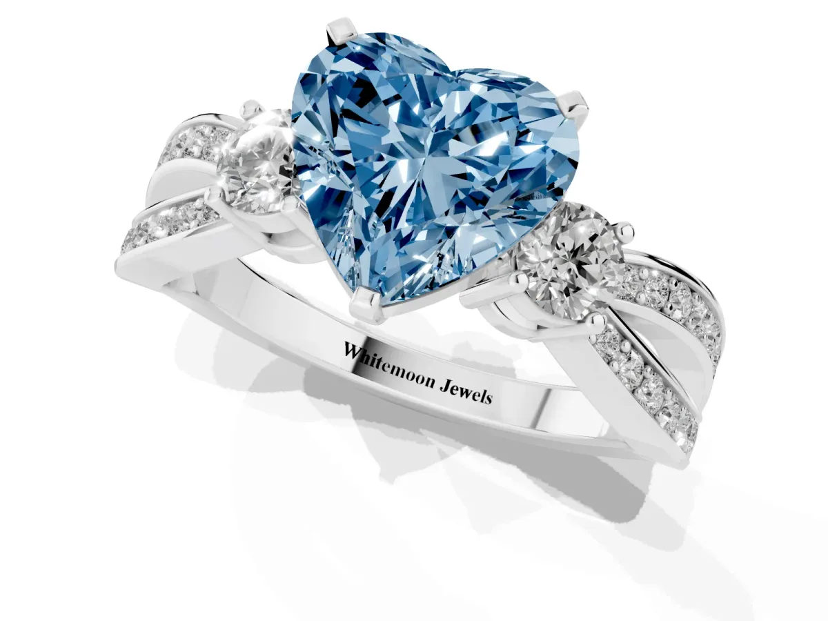 Fancy Blue Three-Stone Heart Cut Cut Diamond Twist Band with Prong Setting Silver