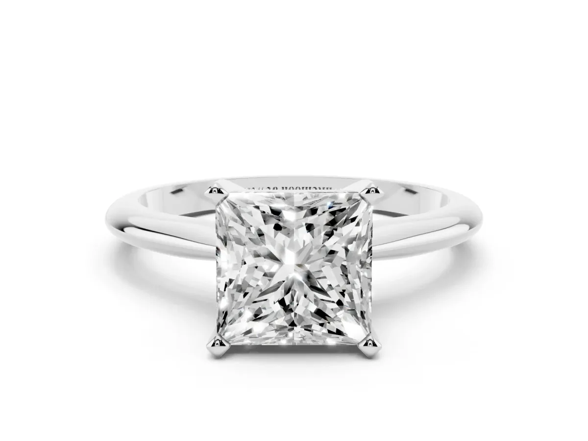 Princess Cut Cut Solitaire Ring with Four-Prong Setting on a Classic Band Platinum