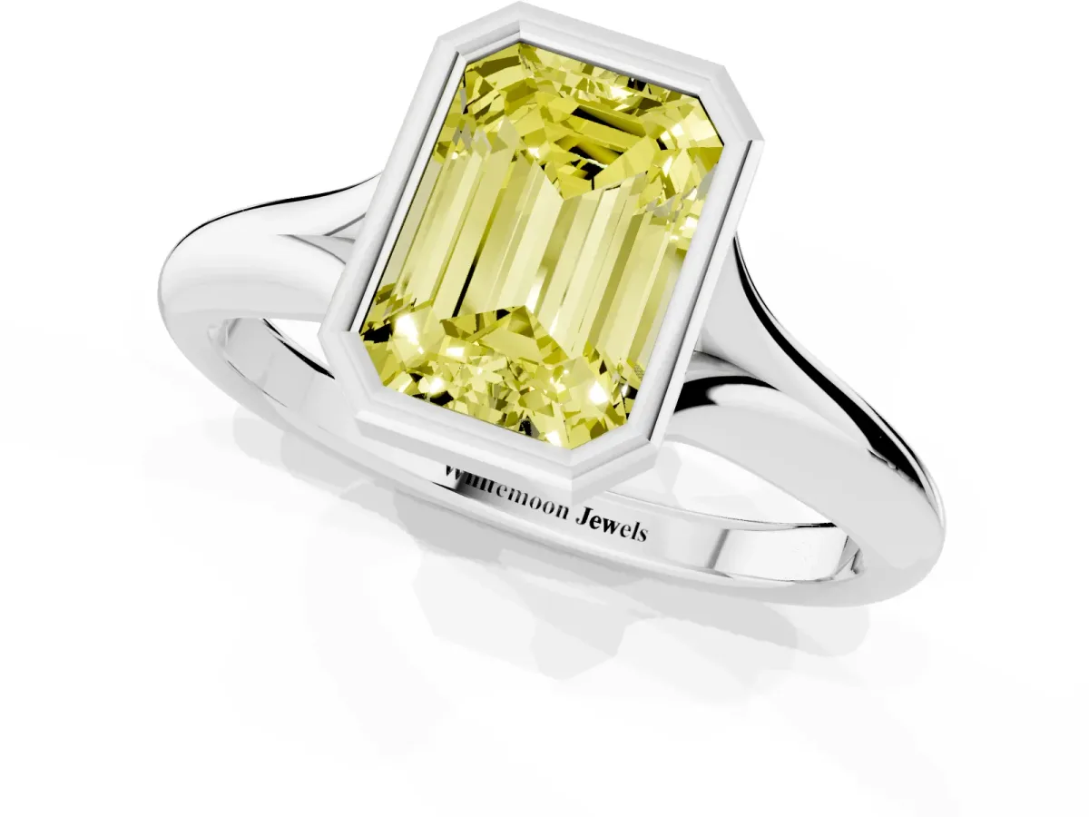 Fancy Yellow Bezel Set Emerald Cut Solitaire Diamond Ring with Smooth Band Silver