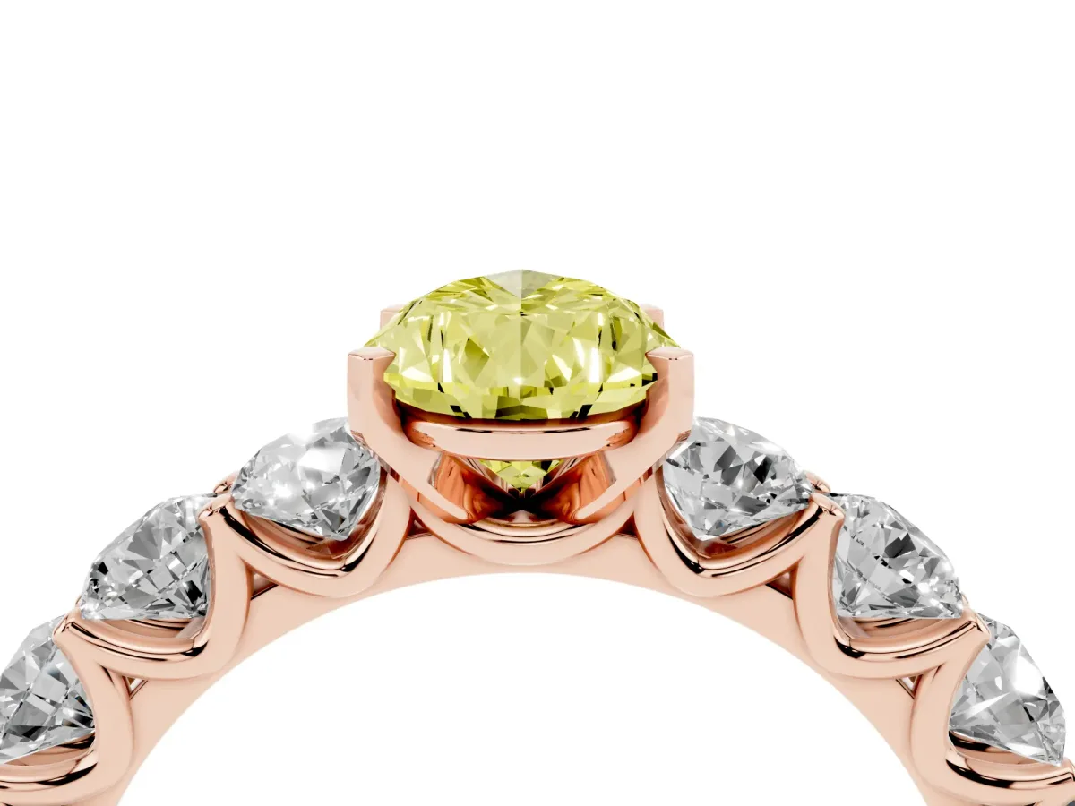 Fancy Yellow Pear Cut Diamond Prong Setting with Side Stones on a Pave Band Rose gold