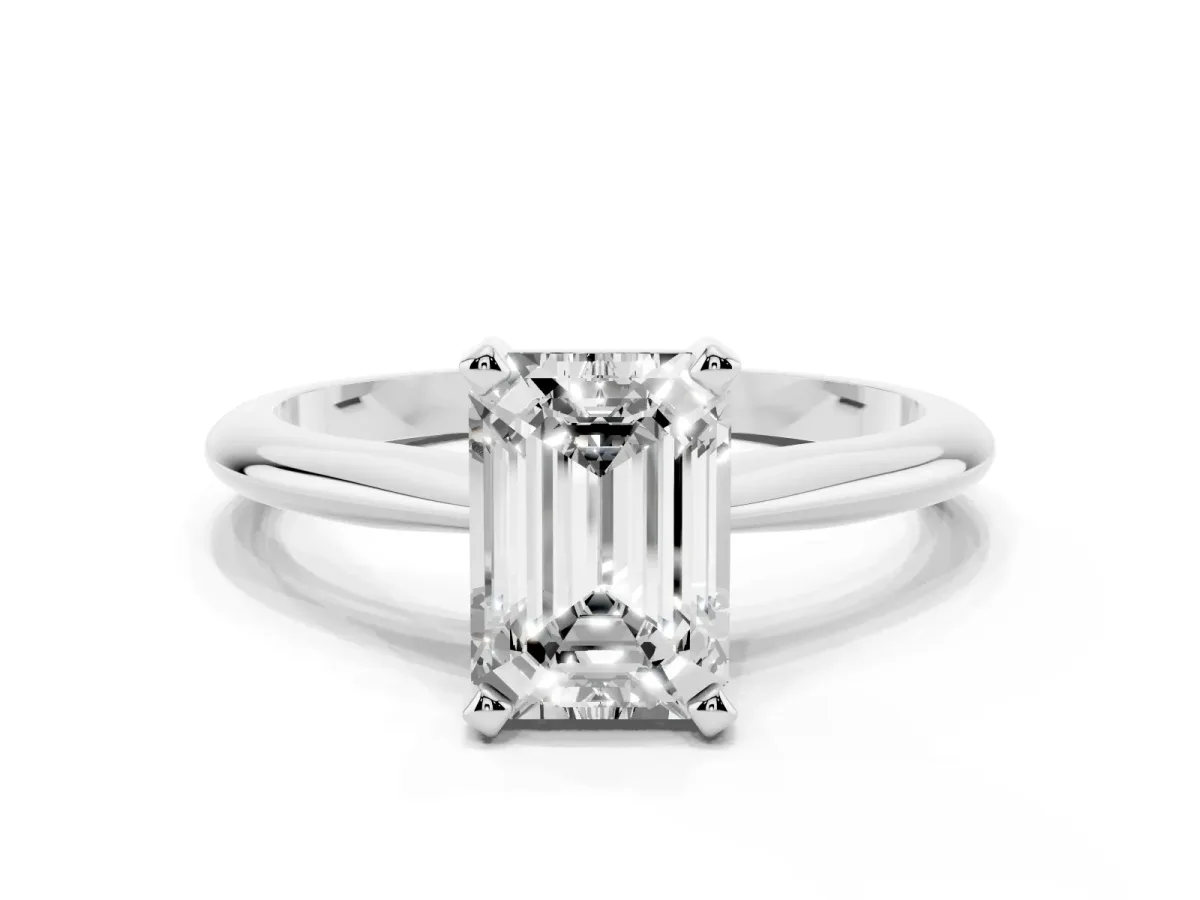 Emerald Cut Cut Solitaire Ring with Four-Prong Setting on a Classic Band Silver