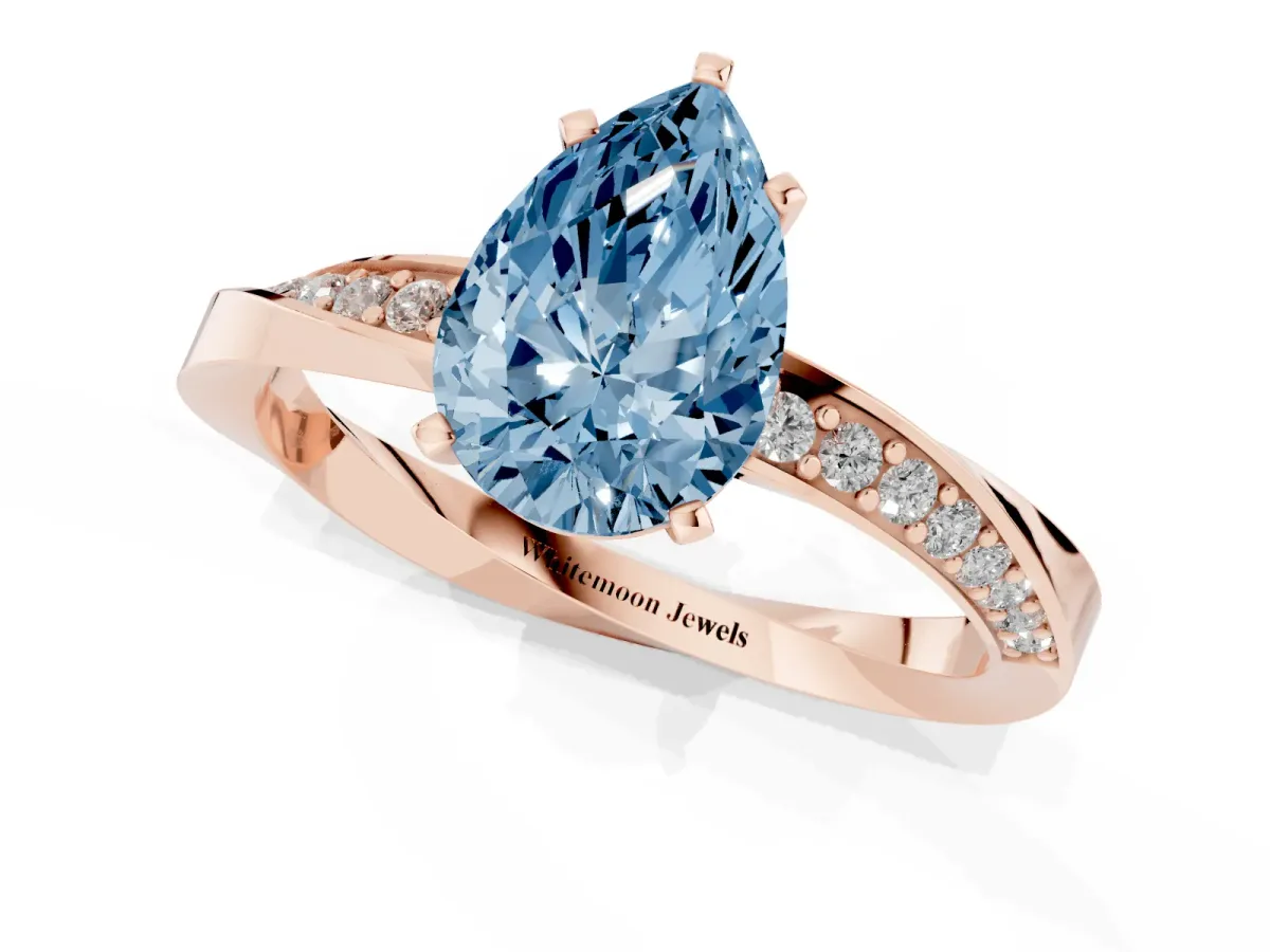 Fancy Blue Pear Cut Diamond Engagement Ring with Side Stone Accents and Four-Prong Setting Rose gold