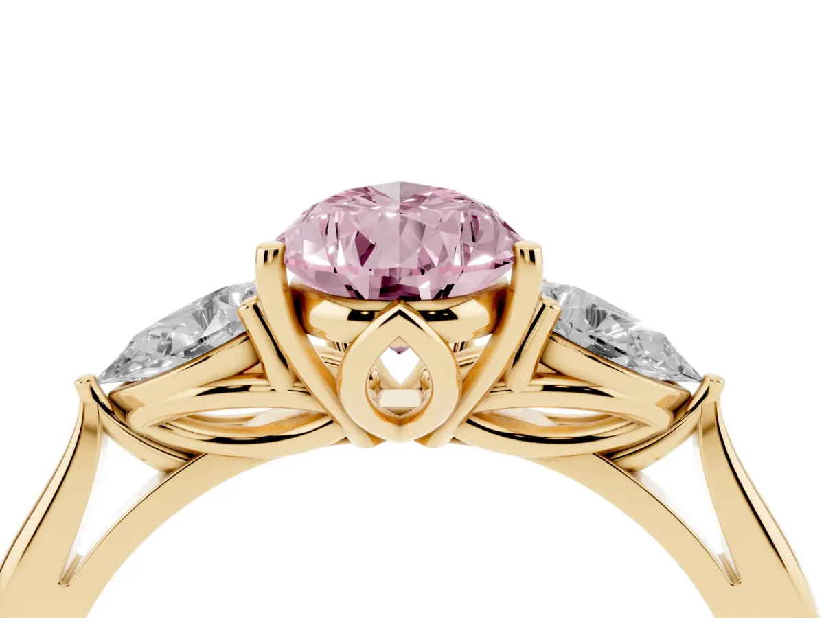 Fancy Pink Three-Stone Pear Cut Diamond Ring with Pear Side Stones in Four-Prong Setting Yellow gold