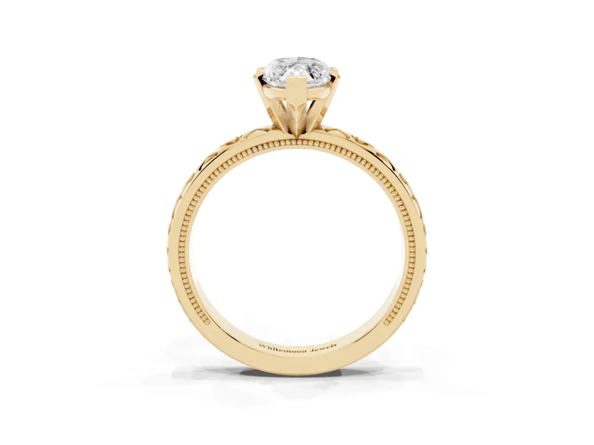 Marquise Cut Solitaire Diamond Engagement Ring with XO Engraved Band and Four-Prong Setting Yellow gold
