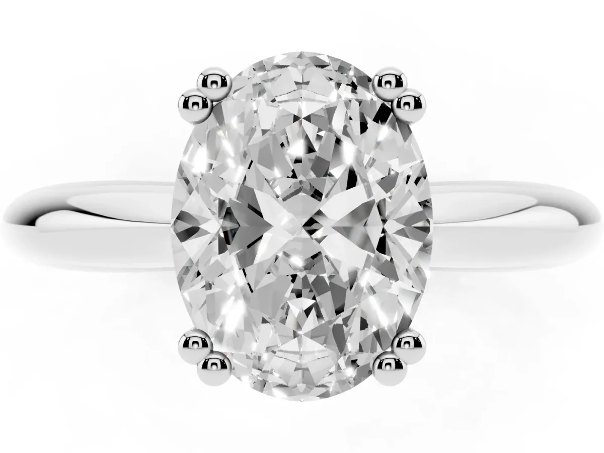 Oval Cut Cut Solitaire Engagement Ring with Tapered Band and Four-Prong Setting Silver