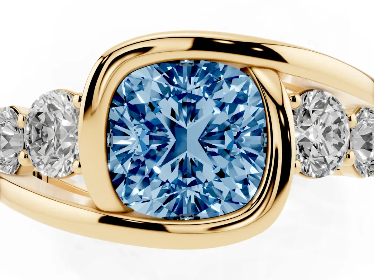 Fancy Blue Bezel Set Cushion Cut Diamond Bypass Ring with Round Accents Yellow gold