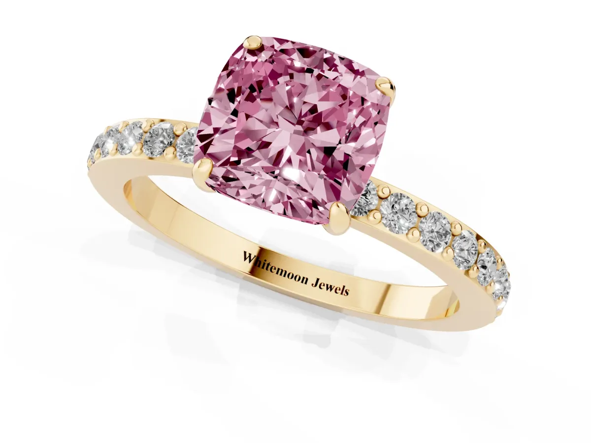 Fancy Pink Cushion Cut Diamond Pavé Engagement Ring with Round Accents and Prong Setting Yellow gold