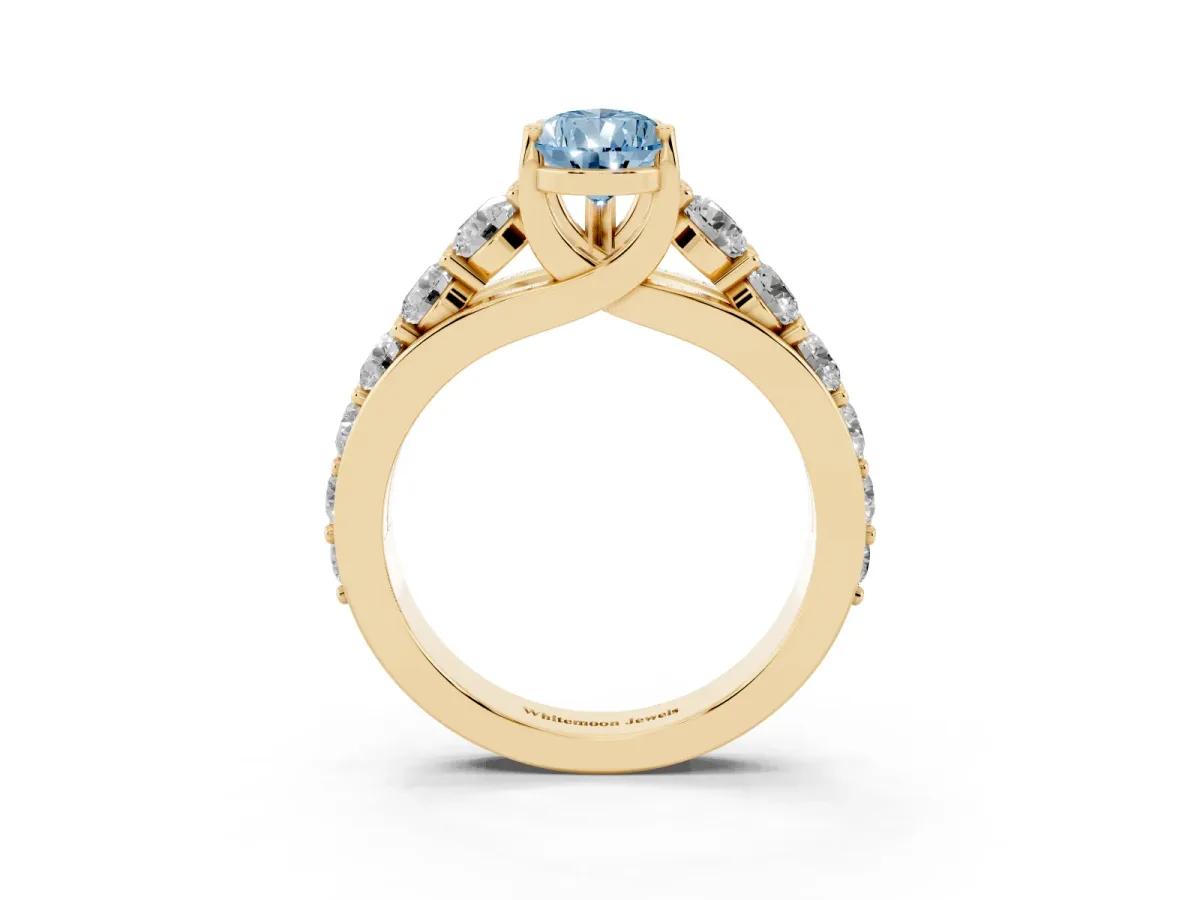 Fancy Blue Pear Cut Diamond Engagement Ring with Pavé Band and Four-Prong Setting Yellow gold